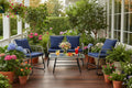 Outdoor furniture set with three chairs and a table on a porch with flower background