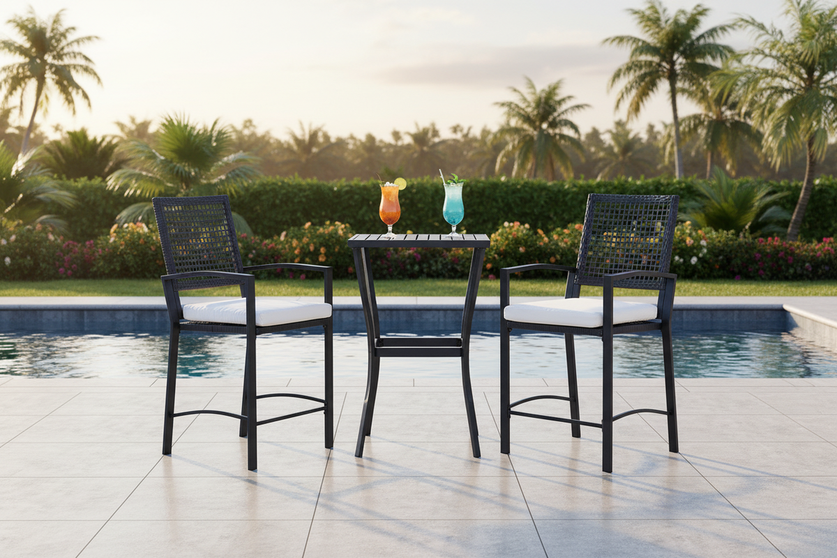 3-piece black wicker bar set with cream cushioned barstools and slat table on a poolside patio